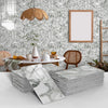 A stack of white marble self-adhesive wall stickers or 3D tile decals displayed on a white surface.