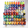 A collection of multi-colored polyester embroidery threads in various shades and colors arranged vertically.