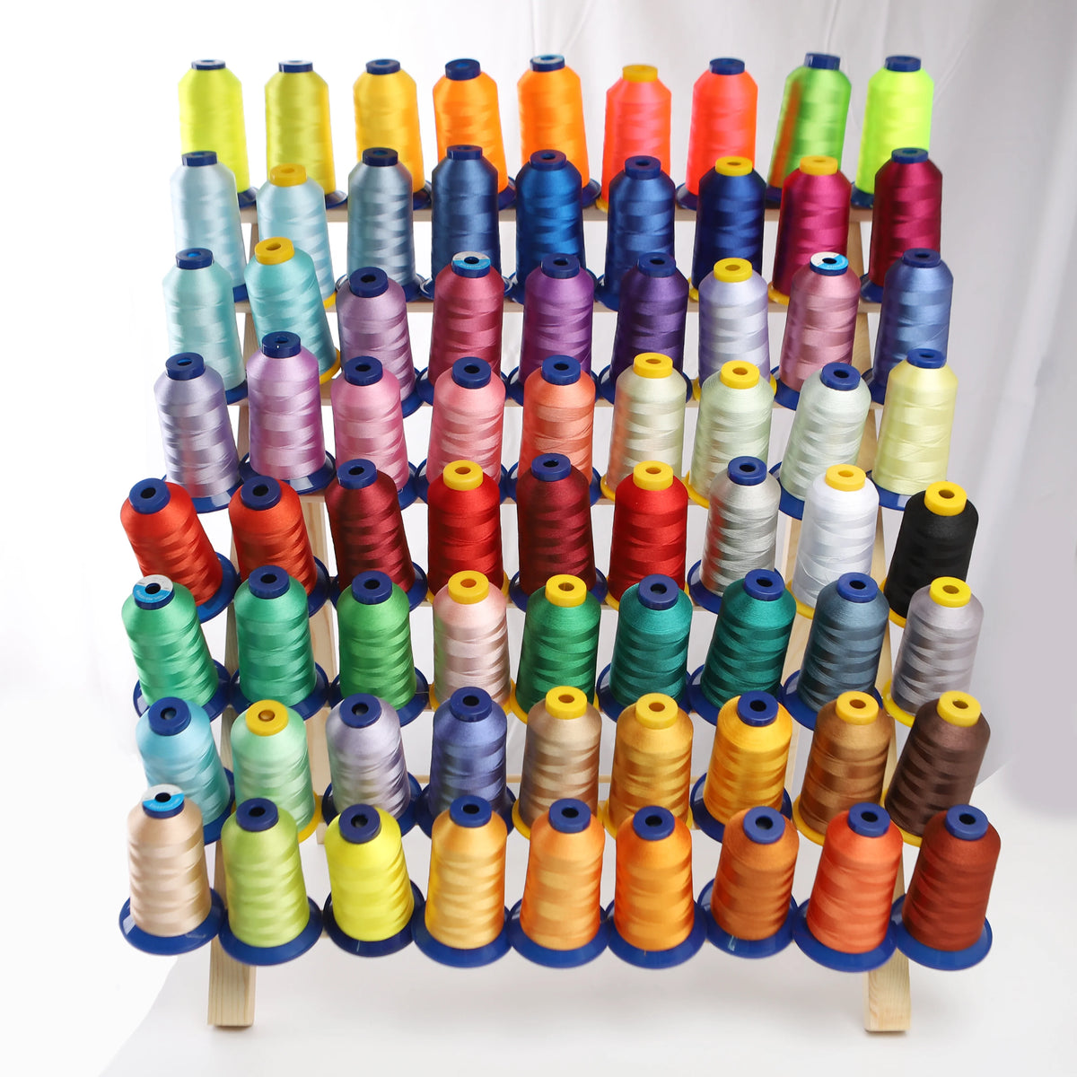 A collection of multi-colored polyester embroidery threads in various shades and colors arranged vertically.