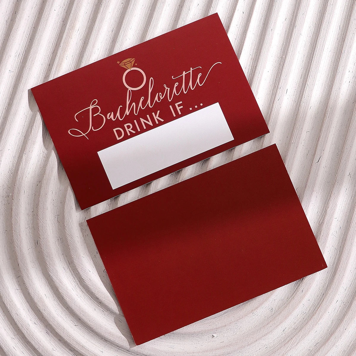 Two red cards featuring a bachelorette theme and a space for a drink if game scratch cards