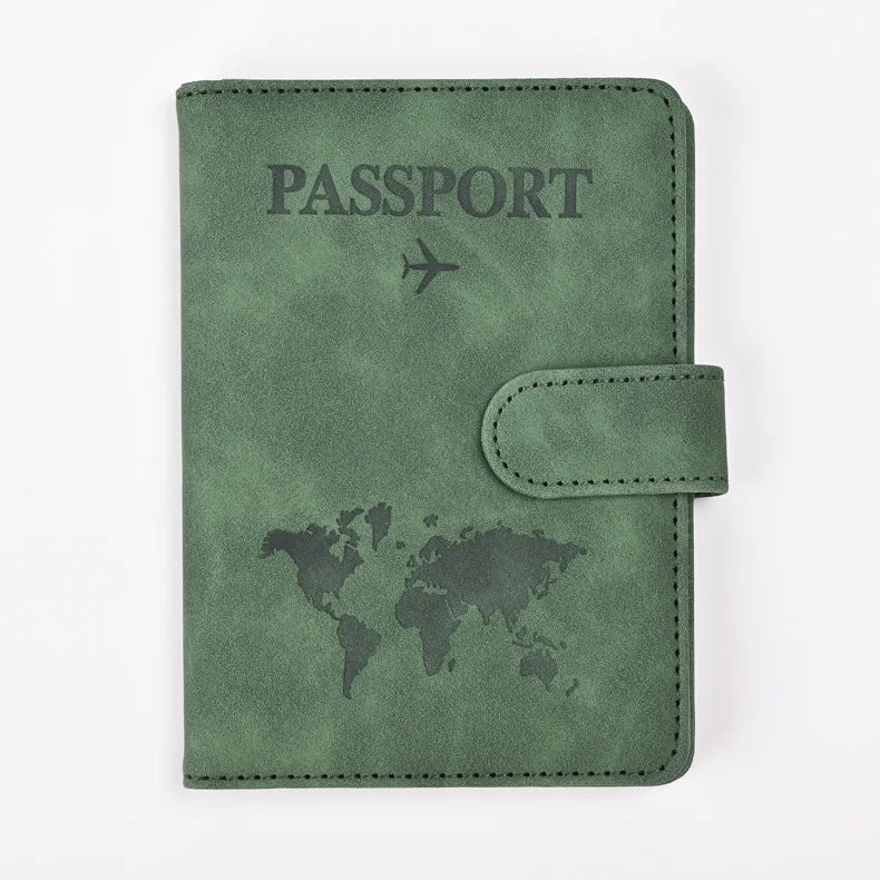 A dark olive green leather passport holder with the word PASSPORT and a world map design.