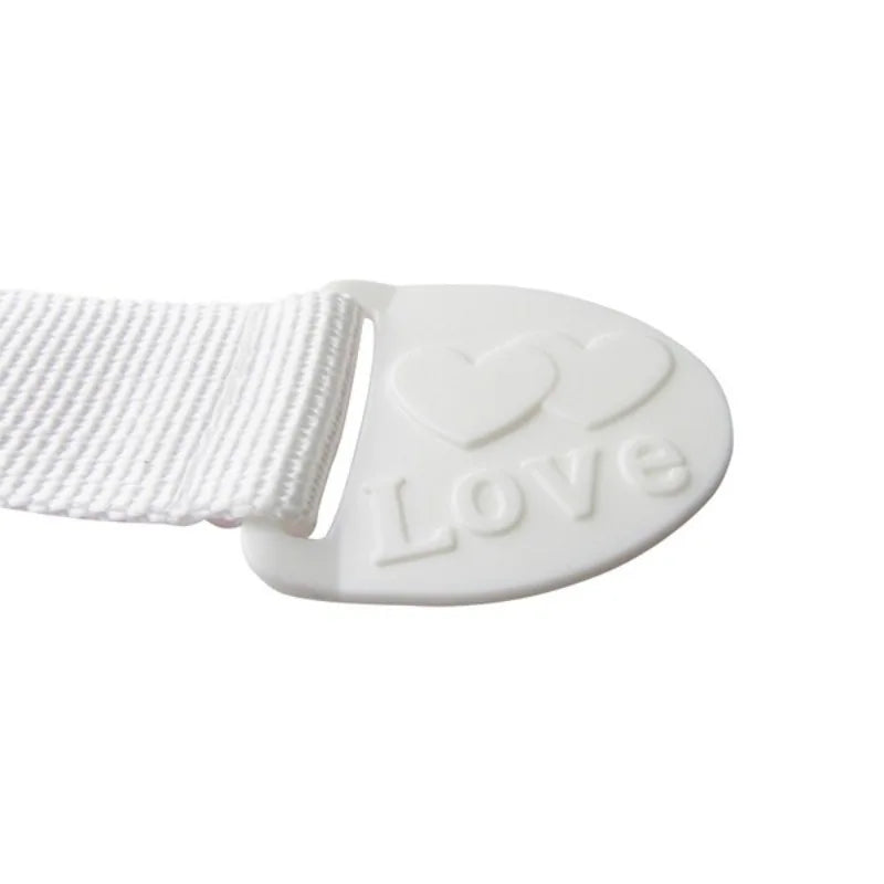 White adhesive baby proofing latch for drawers and cupboards, featuring a heart design.