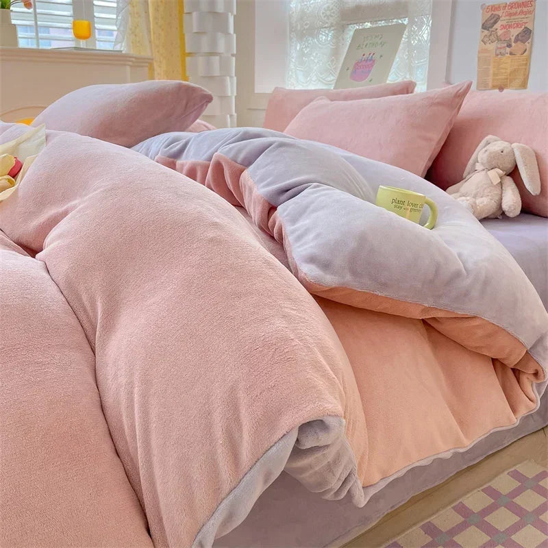 A pink and gray cozy milk velvet bedding set featuring a duvet cover and pillows.