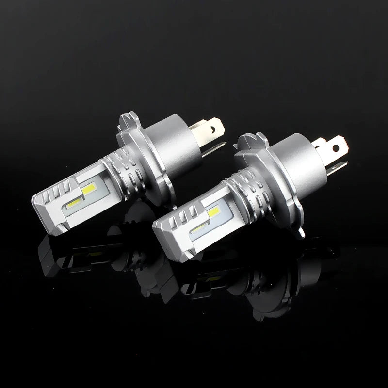 A pair of H4 LED headlight bulbs for a Chevrolet Cruze, showing the silver bulb housing and light elements.