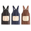 Three waterproof cross-back kitchen aprons in black, navy blue, and brown with removable beige towels.