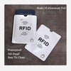 A set of aluminum foil RFID blocking card sleeves, including a clear plastic sleeve and a white card sleeve.