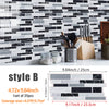 A display of black and white marble texture PVC tiles used as a backsplash or kitchen wall covering.
