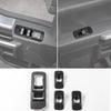 Carbon fiber grain trim cover for center console of a Ford F-150 vehicle.