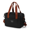Black thermal lunch tote bag with brown straps and waterproof exterior
