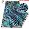 A close-up view of a teal and purple African wax print fabric with intricate geometric patterns.