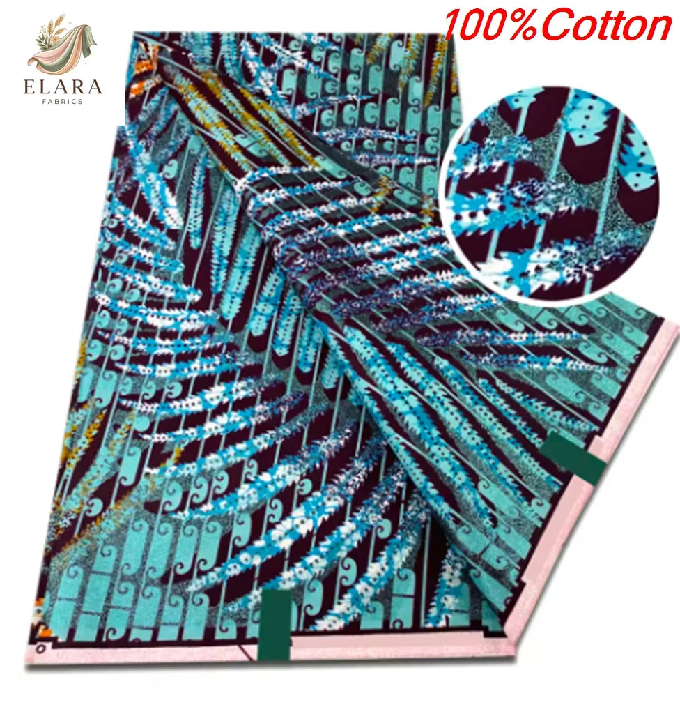A close-up view of a teal and purple African wax print fabric with intricate geometric patterns.