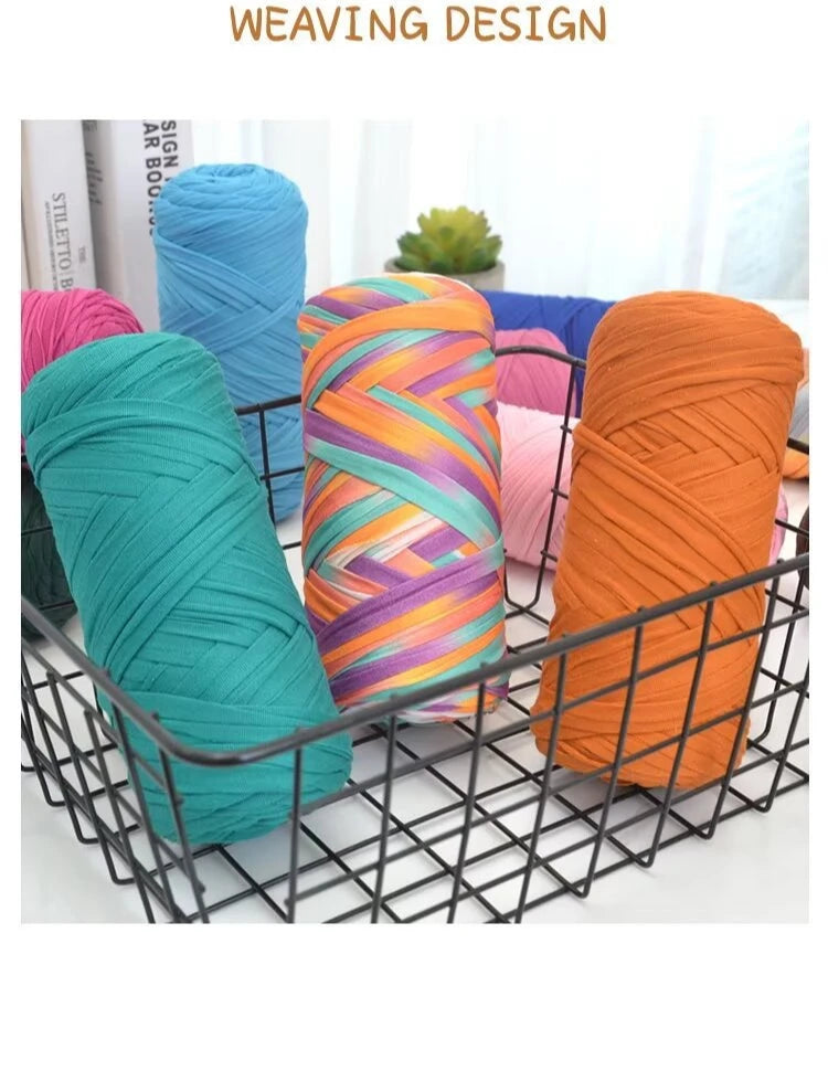 A collection of brightly colored thick yarn skeins in various shades including teal, purple, orange, and pink, displayed in a