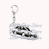 A silver metal key ring attached to a durable keychain featuring an off-road truck design.