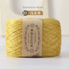 A ball of yellow bamboo fiber yarn labeled for 10 washes.