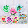Ten eco-friendly wood pulp dish sponges in various floral designs, including green leaves and pink flowers.