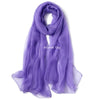 A purple chiffon scarf or silk fabric draped elegantly.