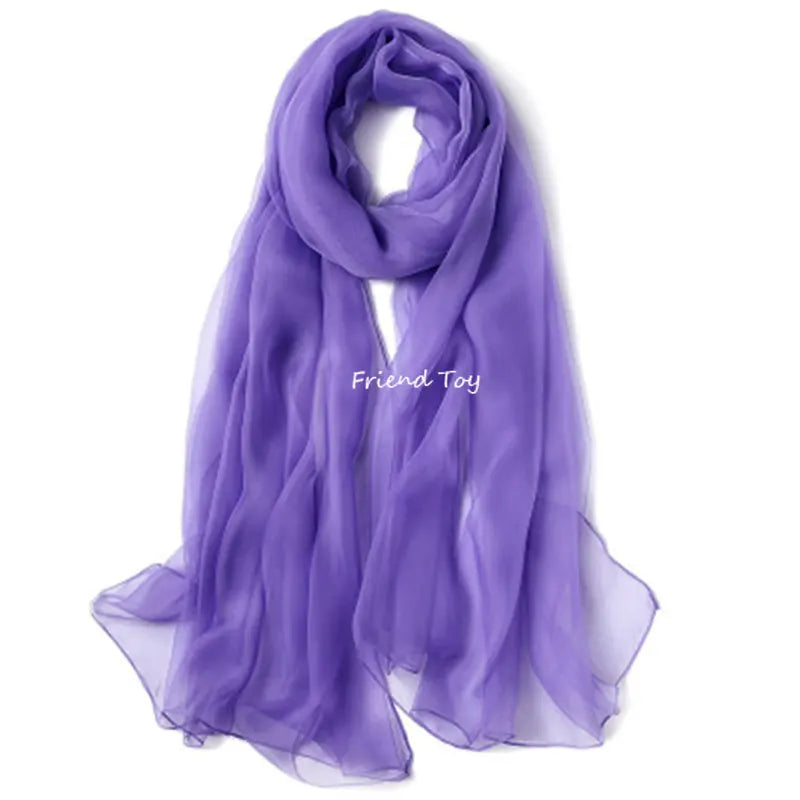 A purple chiffon scarf or silk fabric draped elegantly.