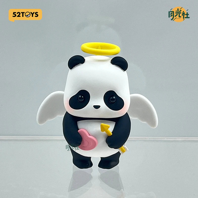 A white and black panda figure with a yellow crown and a pink accessory, displayed against a light gray background.