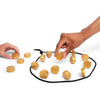 A hand is placing magnetic strategy game pieces onto a black mat.