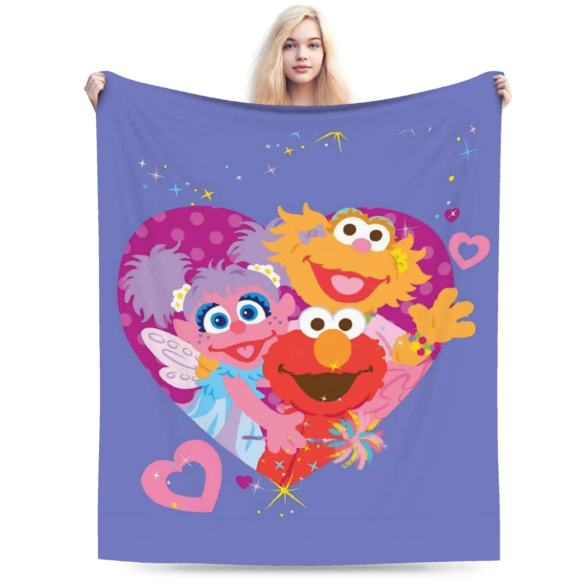 A purple flannel throw blanket featuring a graphic of Elmo and Cookie Monster heads.