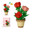 A set of creative flower pot building blocks featuring red roses, yellow sunflowers, and pink carnations.