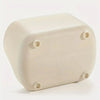 A beige, rectangular desktop organizer with four visible holes on the top surface.
