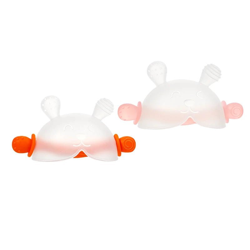 A white bunny-shaped baby teether made of soft silicone with pink accents and orange handles.