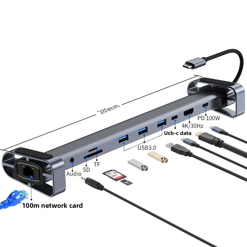 A gray 12-in-1 USB-C docking station featuring multiple ports including HDMI, USB-C, SD, TF, and audio connections.