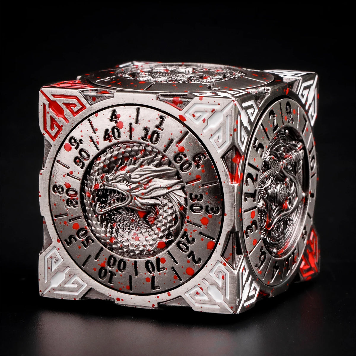 A metallic, multi-function dice cube featuring a dragon design and numbered faces, set against a dark background.
