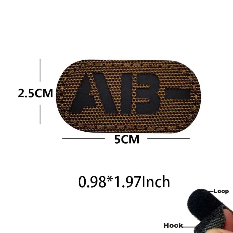 A dark brown glow-in-the-dark blood type tactical patch with hook and loop backing