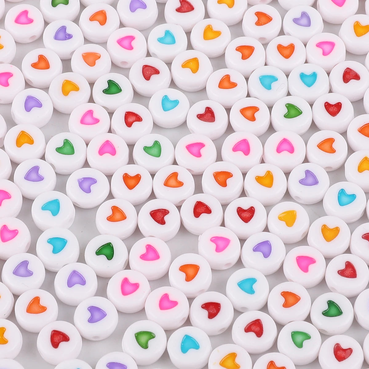 A collection of colorful acrylic letter beads in various shapes and colors for jewelry making