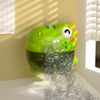 A green dinosaur bubble machine is shown pouring bubbles onto a white surface.