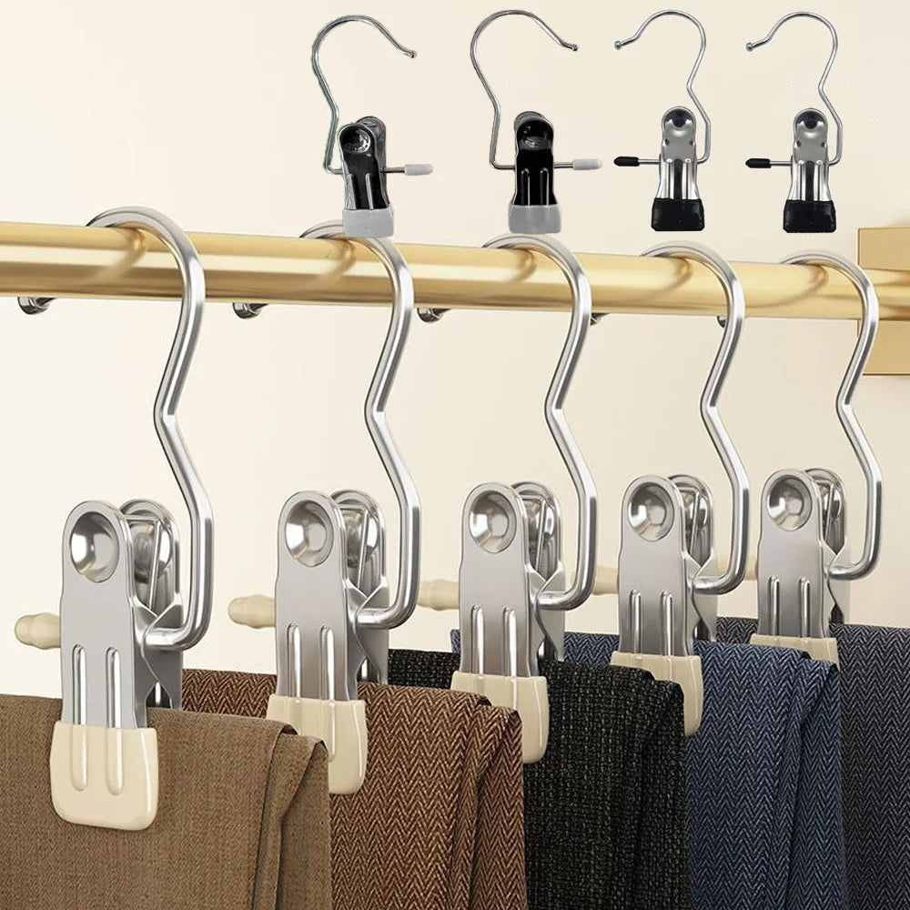 A row of heavy-duty metal hangers used for hanging boots or laundry on a wooden bar.