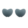 A pair of smooth, heart-shaped silicone beads in a muted gray color.