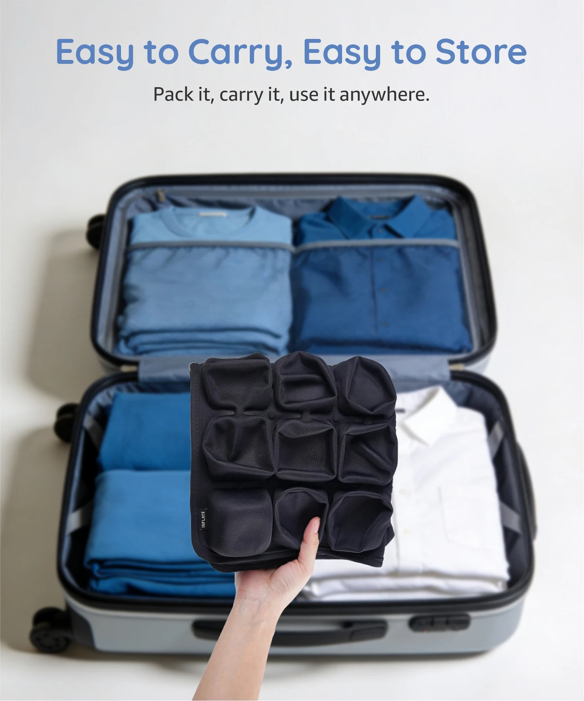 A hand is holding an open black storage box containing folded blue seat cushions and a white shirt.