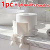 White human-shaped freestanding toilet paper holder with a roll of paper on a marble countertop.