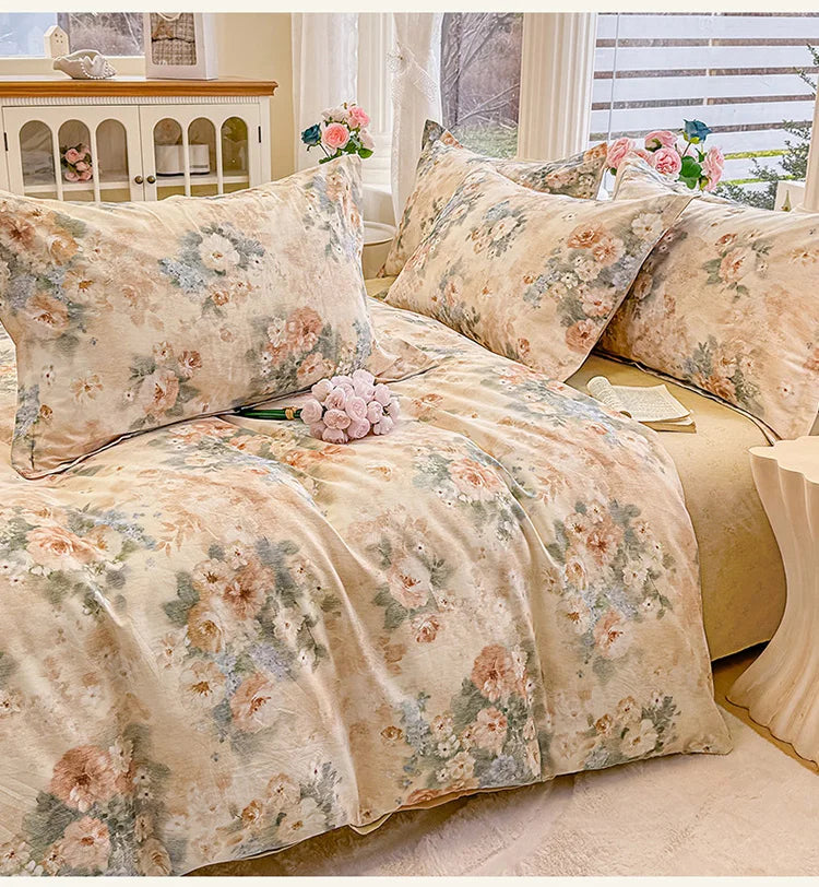 A beige floral printed duvet cover set with matching pillows displayed on a bed.