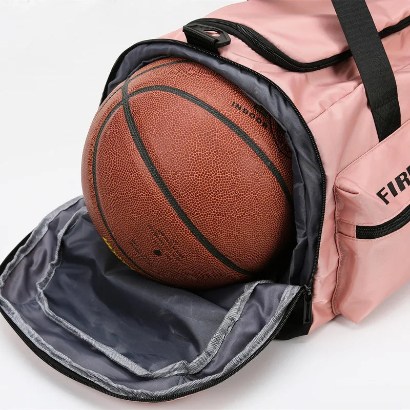 A pink tactical nylon backpack with a black mesh ball inside.