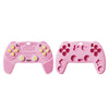 A pink silicone baby teether remote control toy with various buttons and holes.