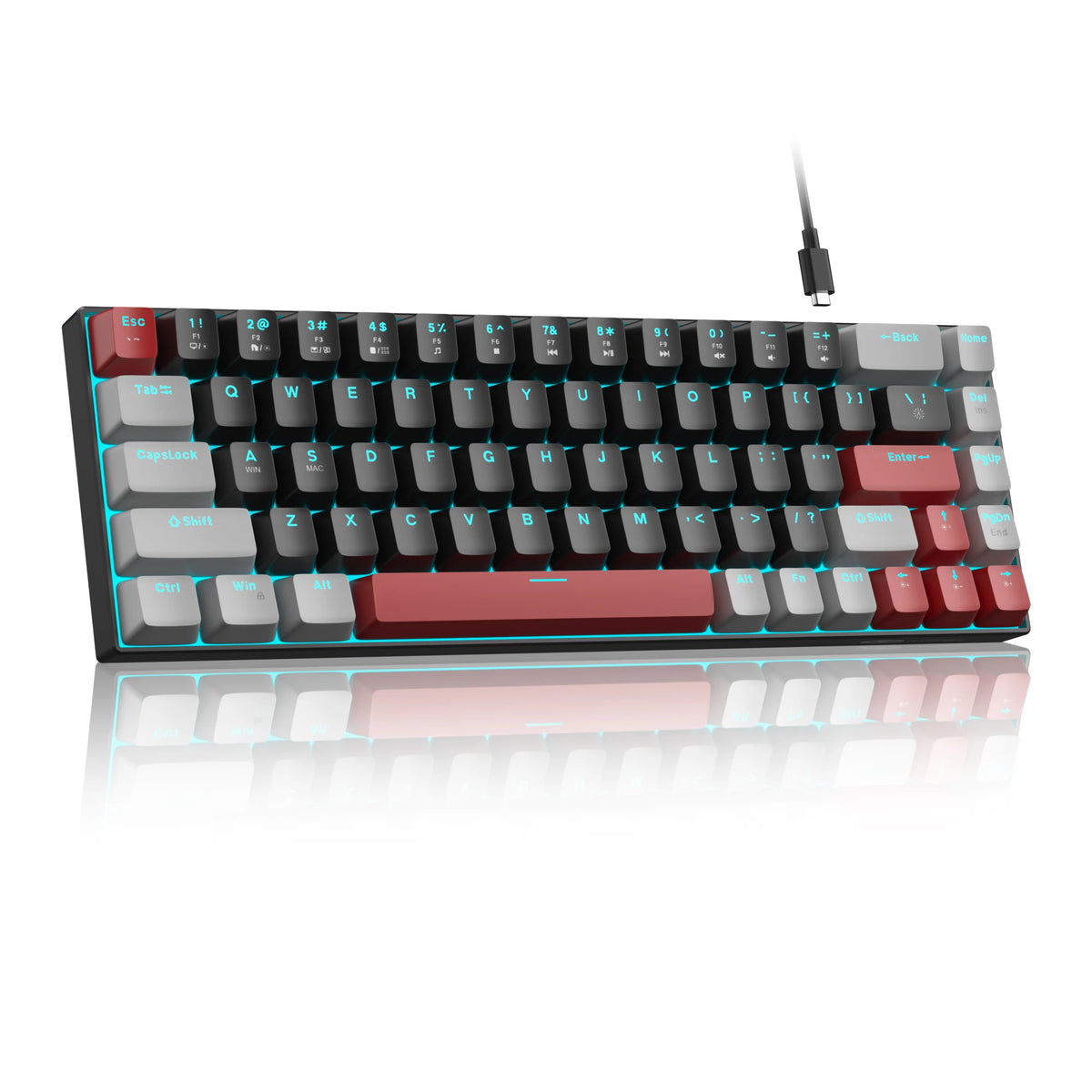 A compact mechanical gaming keyboard with black and red keycaps is shown on a reflective surface.