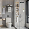 A modern bathroom featuring a toilet, wall-mounted towel hooks, and a glass shower enclosure with stainless steel accessories
