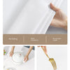 A white fabric is shown being pressed, with features like no fading, wear resistance, and no peculiar smell highlighted.