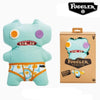 A light blue plush toy of an ugly monster with funny teeth and a matching cardboard box.