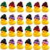 A collection of yellow rubber duck car dashboard ornaments in various colors and with accessories.