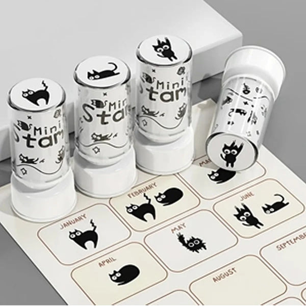 A set of eight mini stamps featuring cute black cat designs on white cylindrical containers.