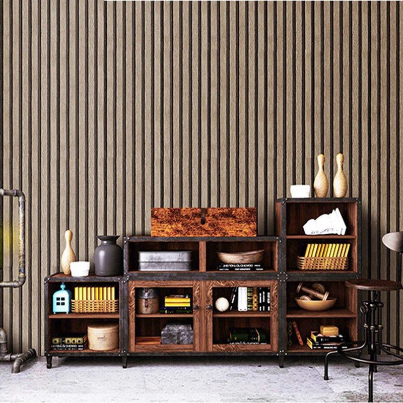 A dark wood shelving unit with multiple compartments and drawers against a textured wall.