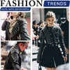 A model wearing a black leather jacket adorned with silver cone studs and spikes, paired with a black skirt.