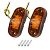 A pair of amber LED side marker clearance lights for trucks, trailers, and caravans with wiring and mounting screws.