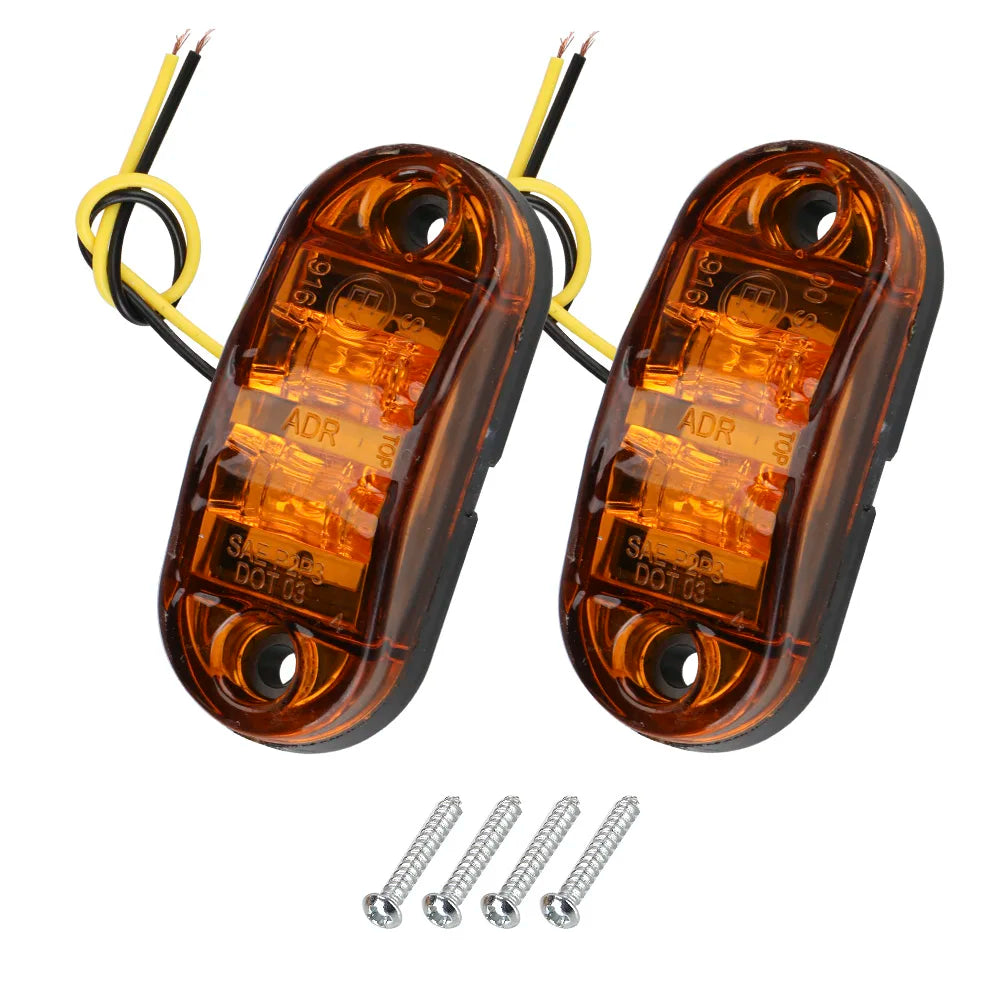 A pair of amber LED side marker clearance lights for trucks, trailers, and caravans with wiring and mounting screws.