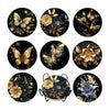 A collection of eight dark-themed diamond art coasters featuring floral and butterfly designs.